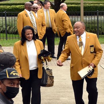 Photo showing Hall of Fame members in gold jackets smiling
